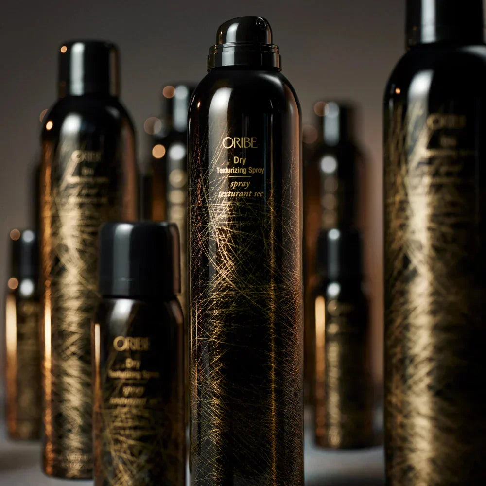 Several cans of Oribe Iconic Dry Texture spray