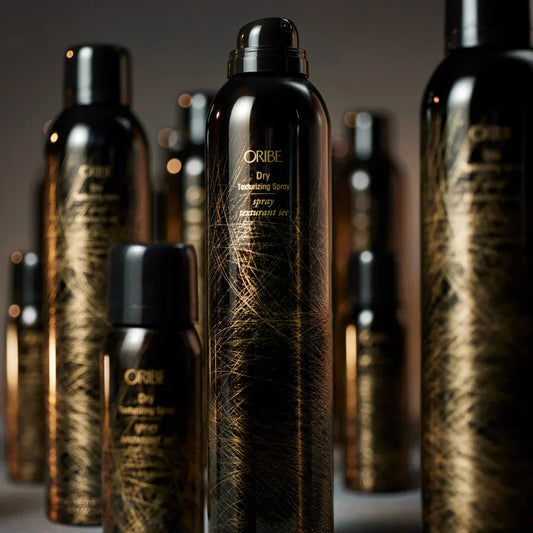 Several cans of Oribe Iconic Dry Texture spray