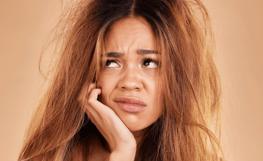 women frustrasted with frizzy dry hair
