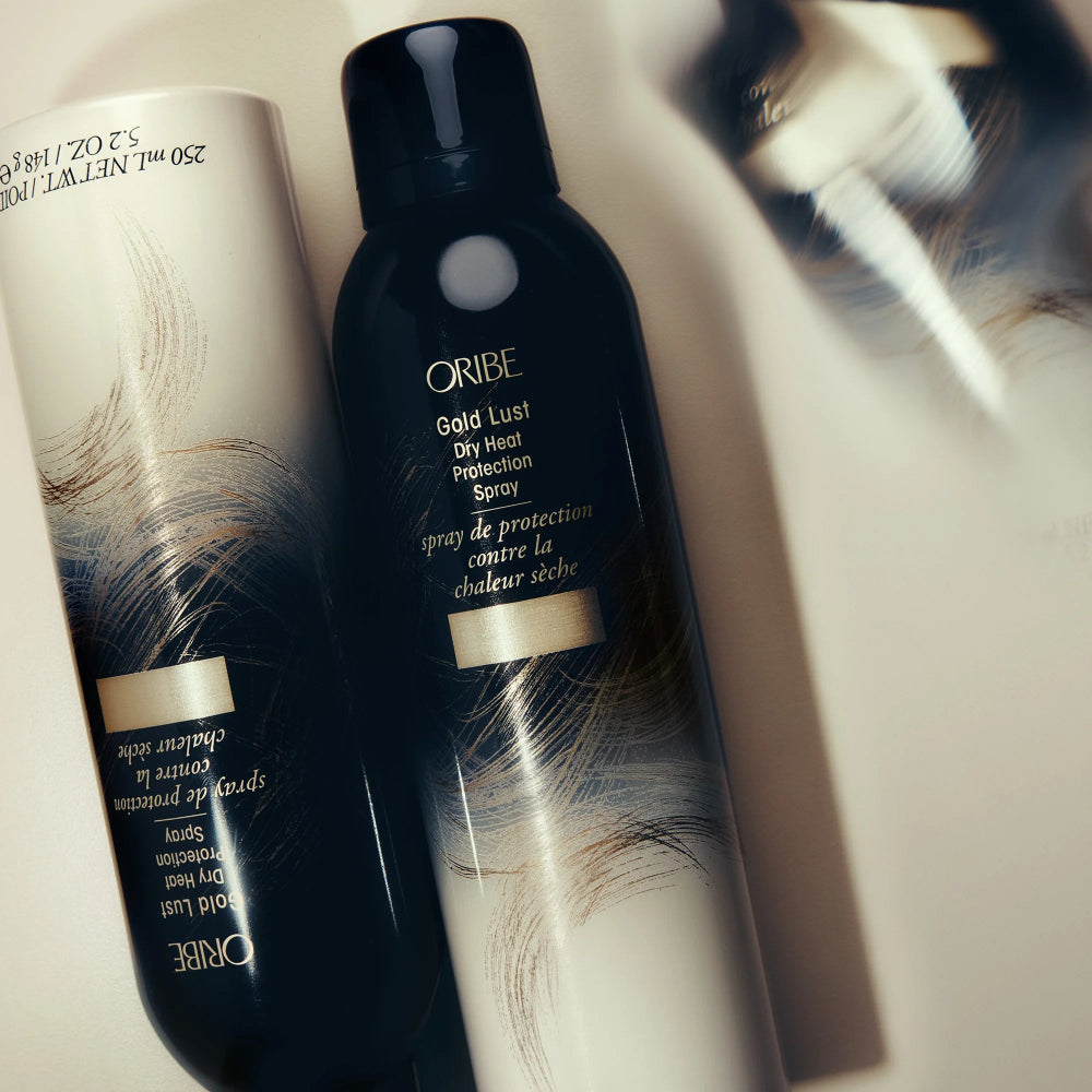 Oribe Gold Lust heat protectant spray bottle for styling protection and hair health