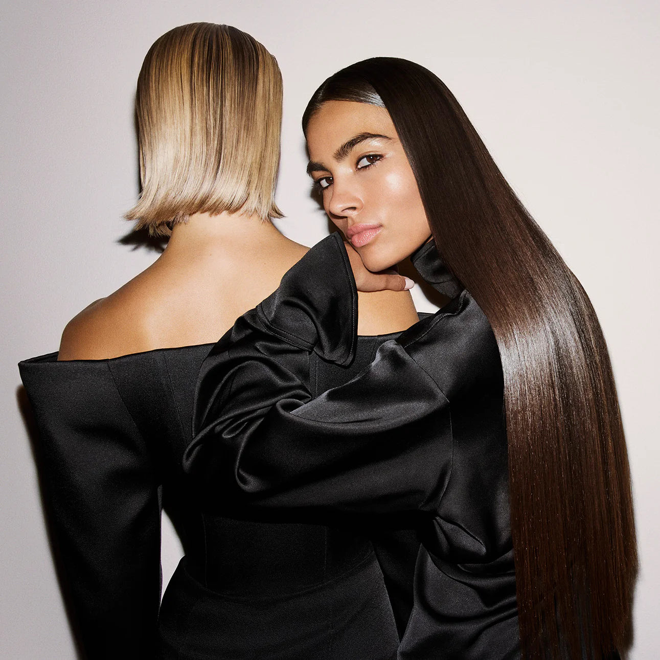 models with smooth, glossy straight hair using Oribe Supershine Light Cream for lightweight frizz control