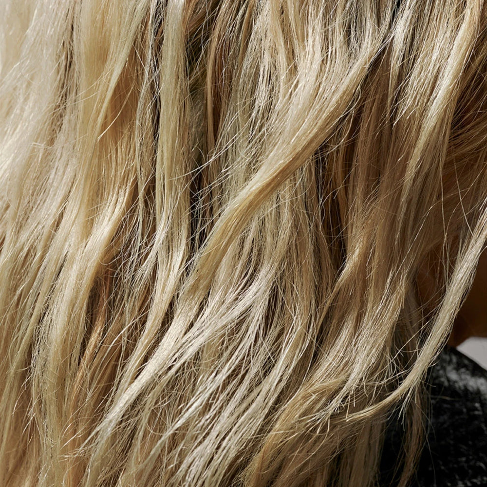 Defined hair texture using Oribe Flash Form spray wax for separation and shine
