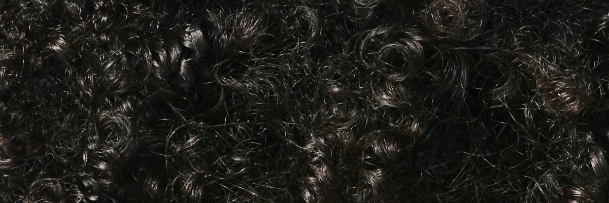 Close-up of dark, textured hair