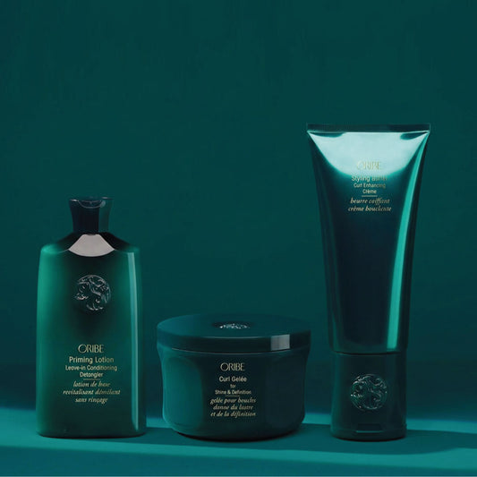 Oribe curl styling set with Priming Lotion Leave-In, Curl Butter, and Curl Gelée for deep hydration and defined curls