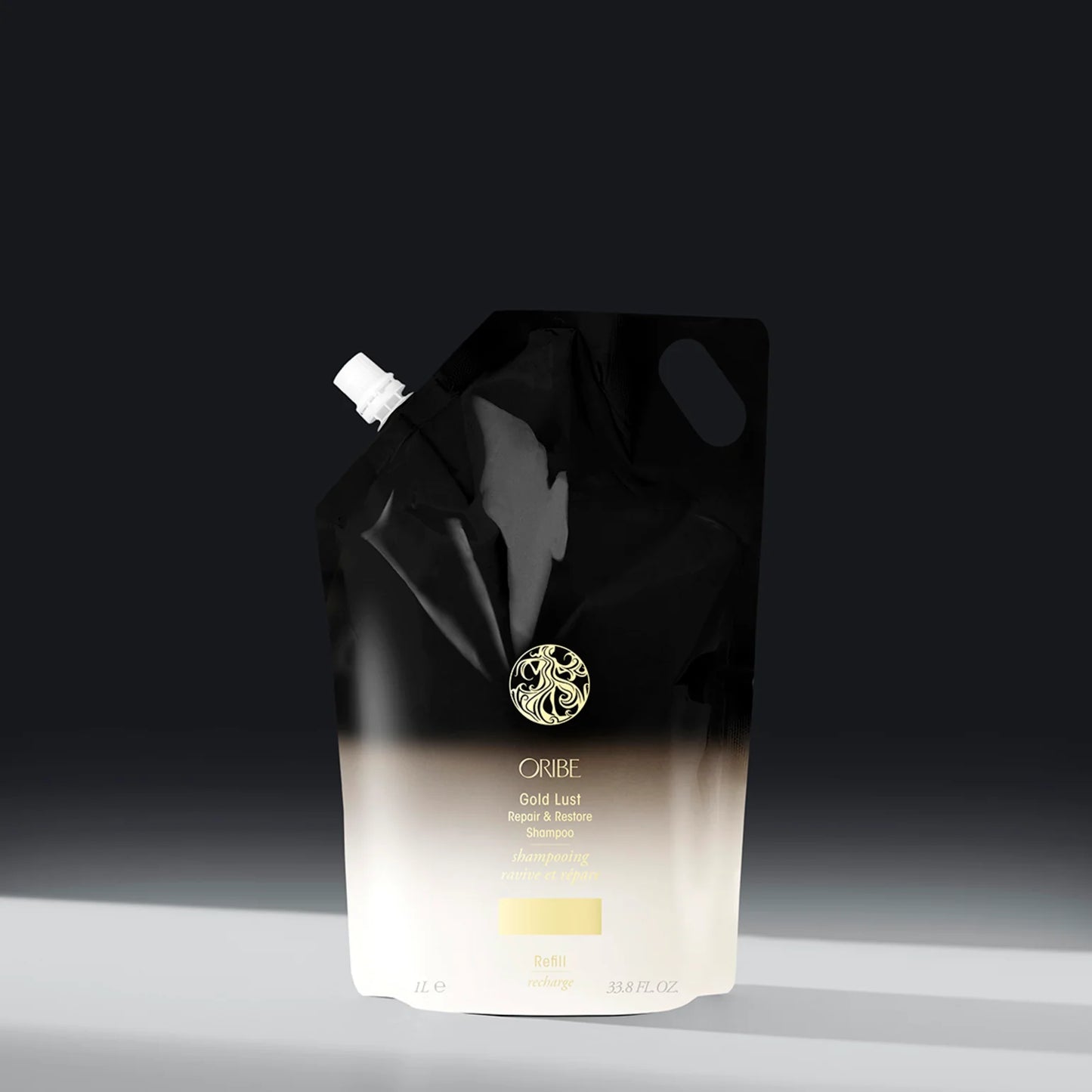 Gold lust restorative shampoo on a dark background