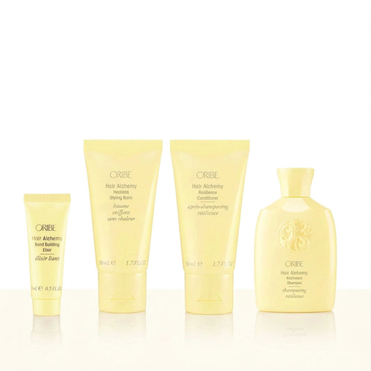 Oribe Hair Alchemy Heatless Style Set + Bond Builder featuring travel-size Hair Alchemy Resilience Shampoo, Resilience Conditioner, Heatless Styling Balm, and Bond Building Elixir