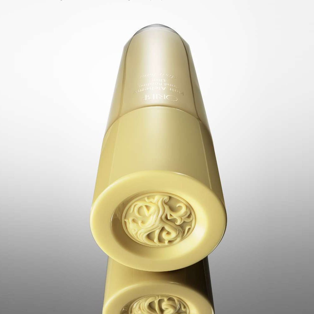 Oribe Hair Alchemy Bond Building Elixir bottle showing signature base design and luxury packaging detail