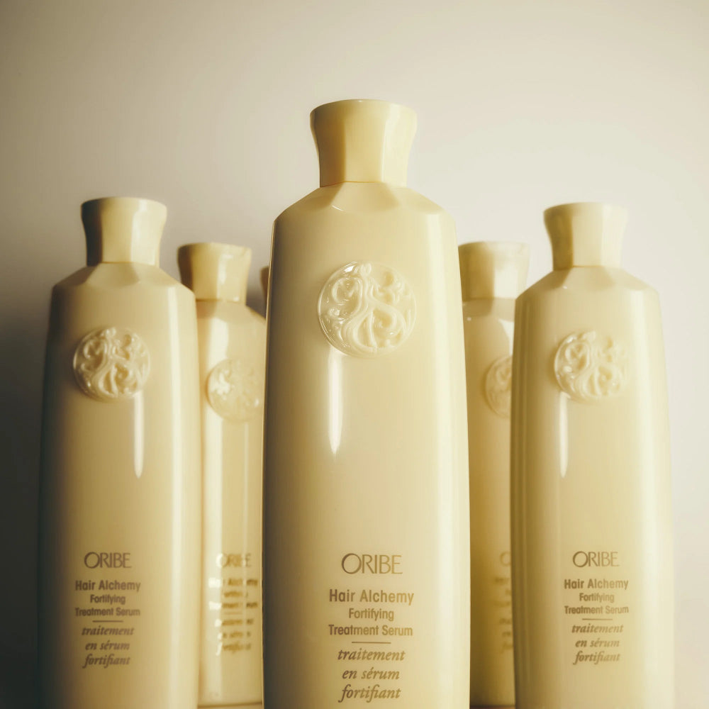 Oribe Hair Alchemy fortifying Treatment Serum bottle close-up highlighting gold packaging