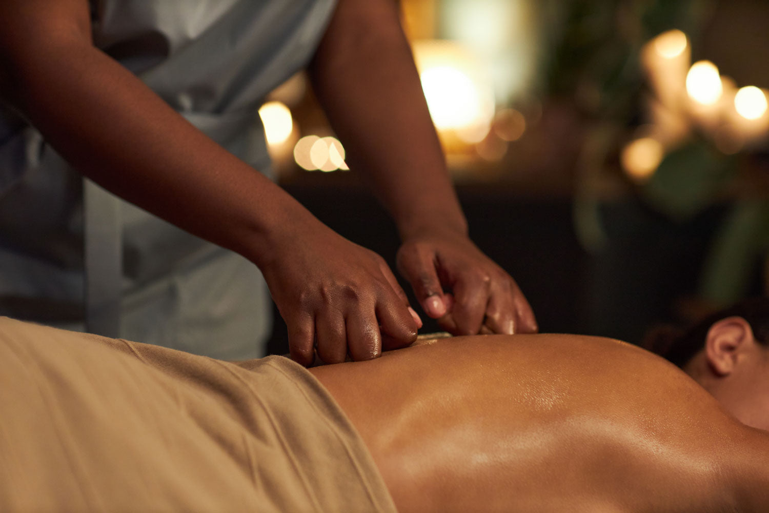 Guest receiving a relaxing and therapeutic massage at Dolce Lusso Salon and Spa
