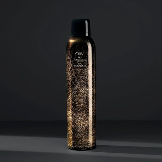 Close-up of Oribe Dry Texturizing Spray bottle, the award-winning volume and texture styling spray.