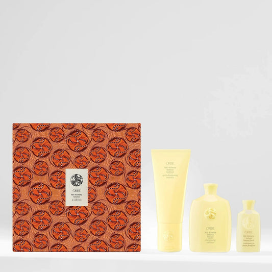 Oribe Hair Alchemy Strength & Length Set with limited-edition patterned gift box, shampoo, conditioner, and treatment serum