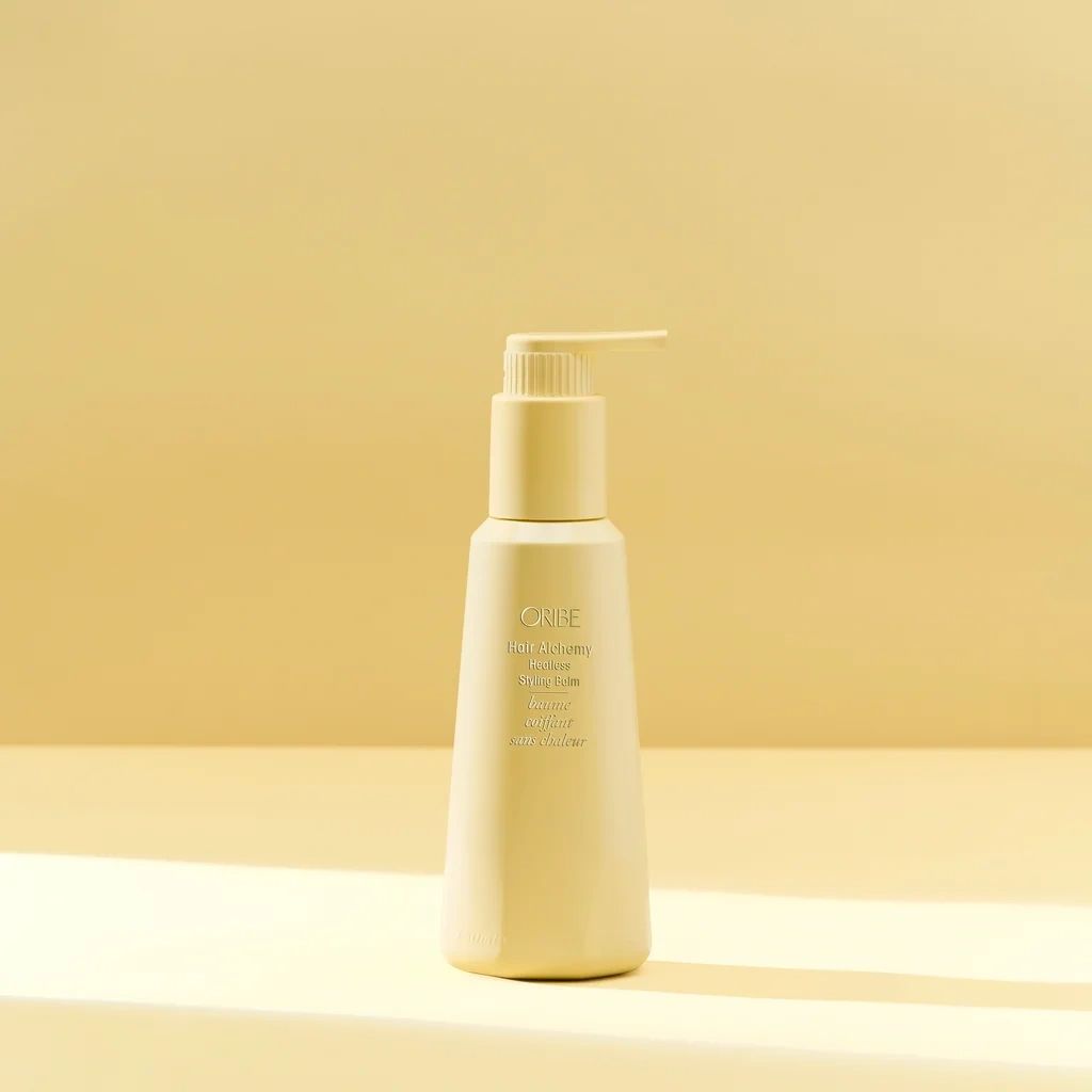 Oribe Hair Alchemy Heatless Styling Balm bottle for air-dry styling and enhancing natural hair texture