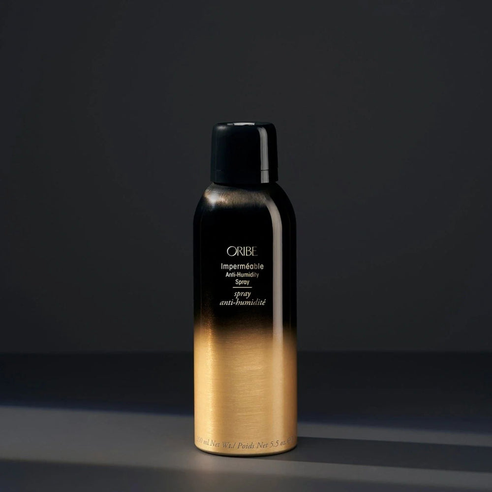 Oribe Impermeable Anti-Humidity Spray luxury hair styling product bottle on dark background