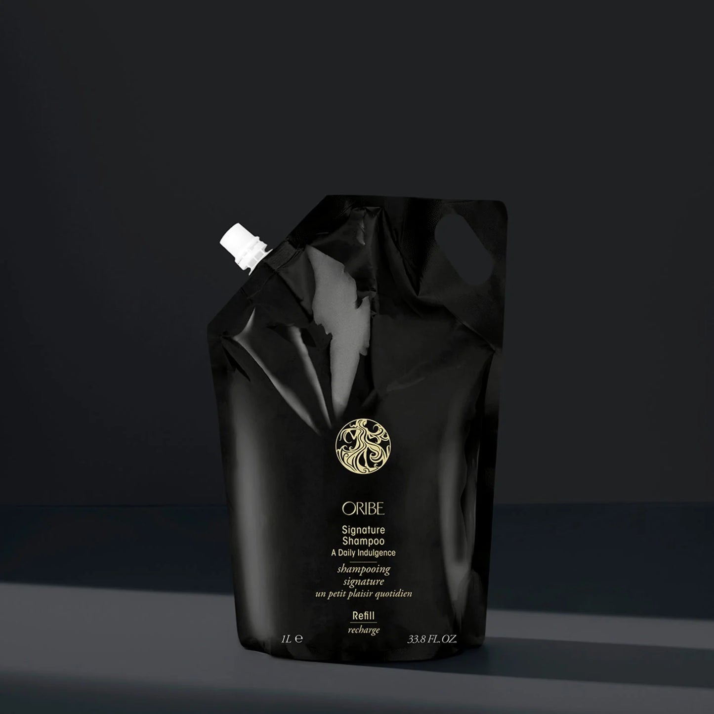 Oribe_Refill_Liter_Signature_Shampoo on a dark background