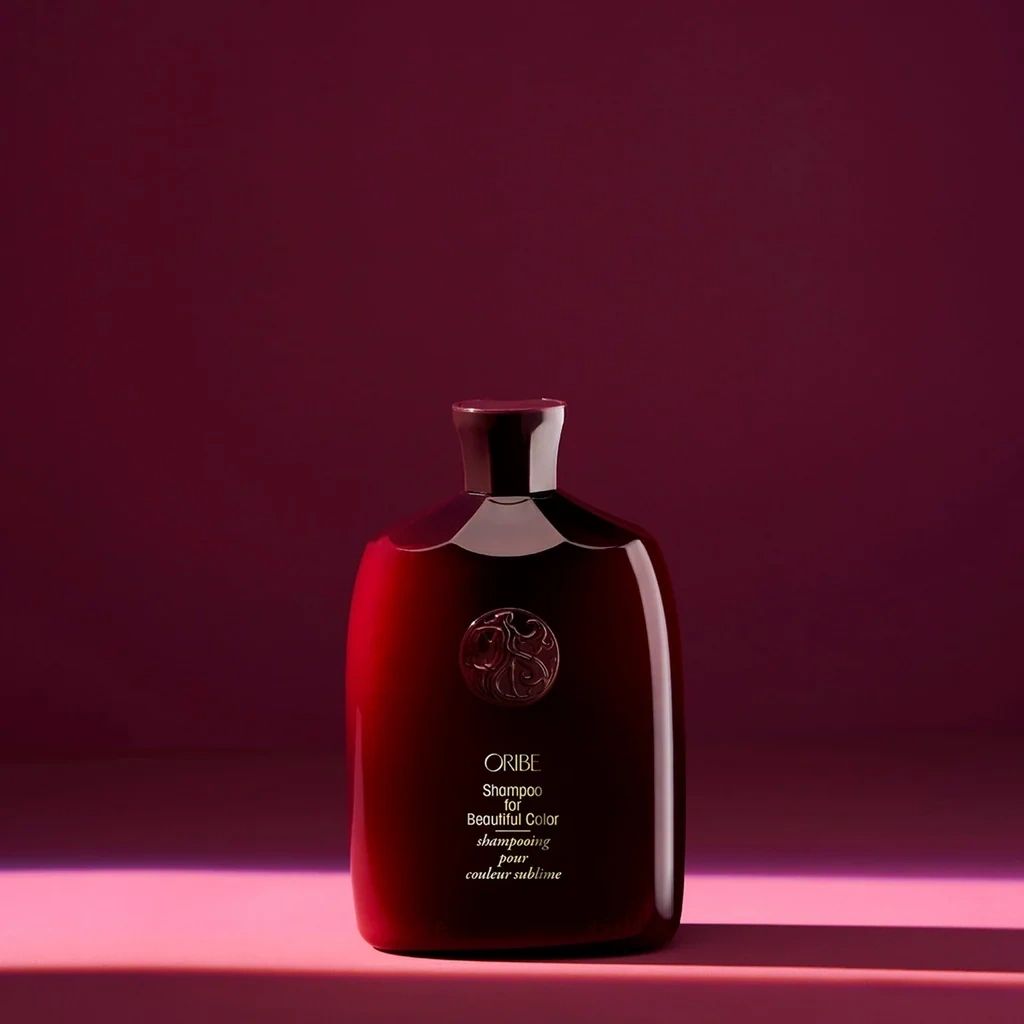 Oribe Shampoo for Beautiful Color in red bottle for color protection, shine, and gentle cleansing