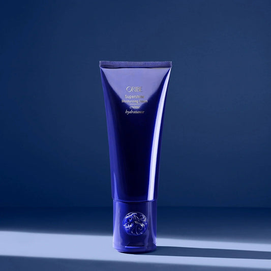 Oribe Supershine Moisturizing Cream in blue tube for deep hydration, shine, and frizz control