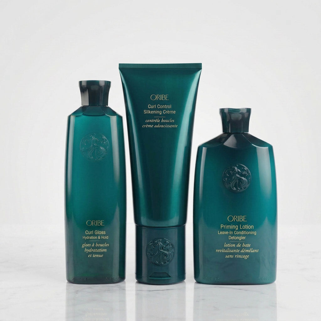 Oribe curl styling trio featuring Curl Gloss, Silkening Crème, and Leave-In for complete curl care routine