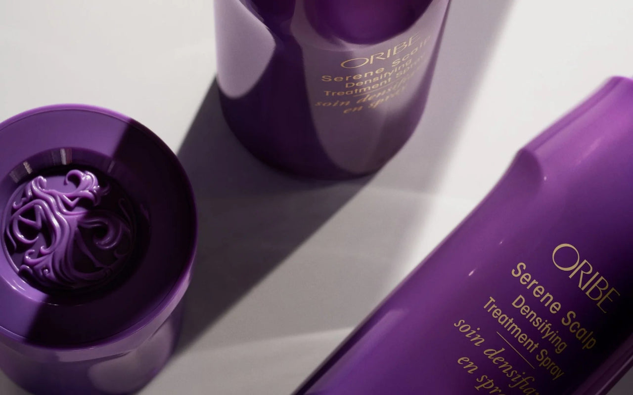 Close up of bottles of Oribe Densifying products