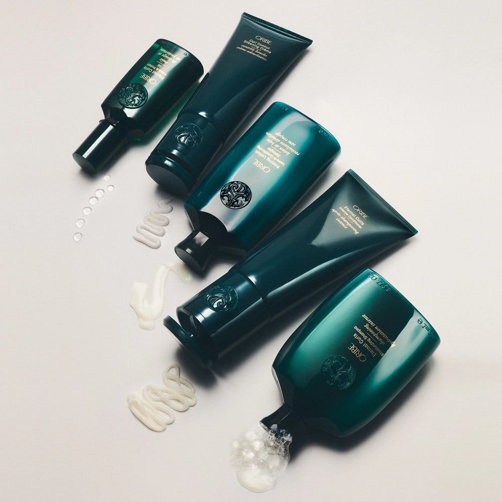 Oribe curl styling collection with curl cream, gel, and leave-in products for hydrated, defined, frizz-free curls