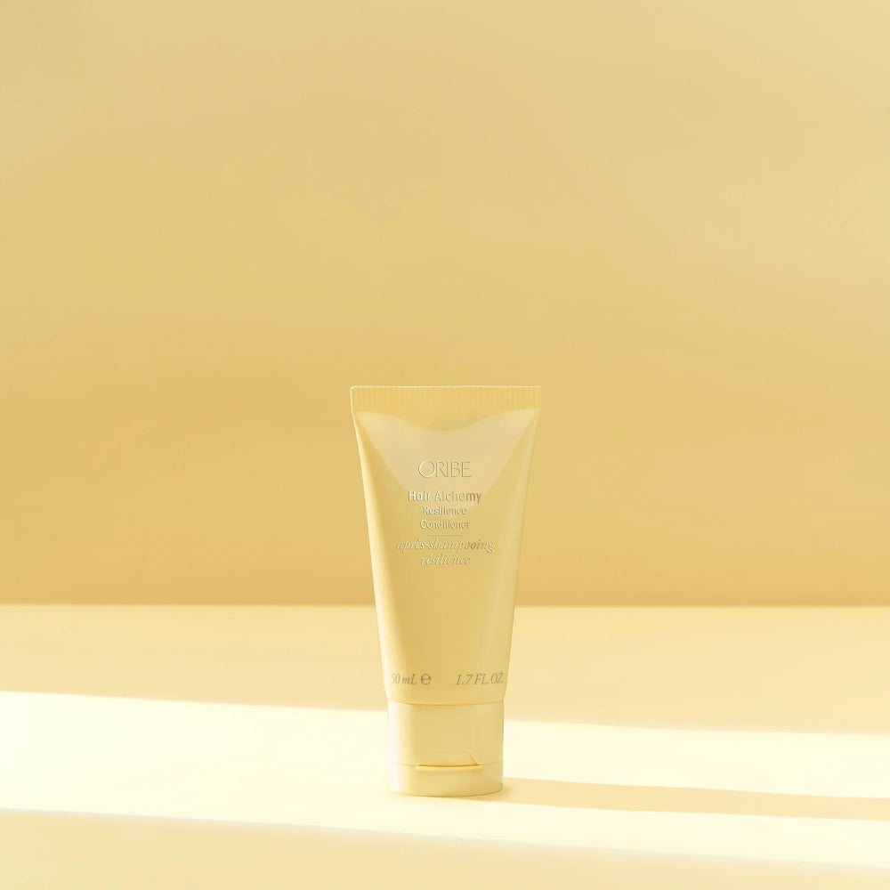 Travel Size Oribe Hair Alchemy conditioner for smoothing detangling and strengthening hair