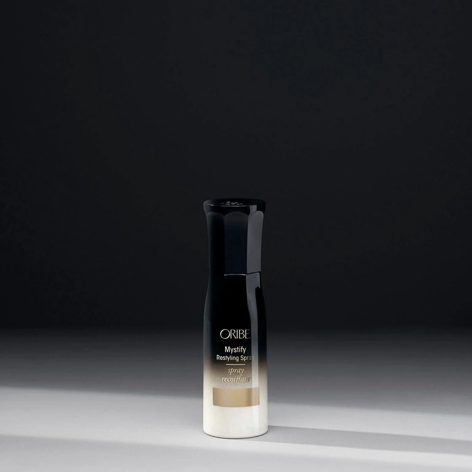 Travel Size Oribe Mystify spray for reactivating styles and adding light hydration to hair
