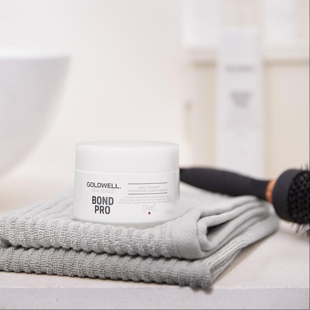 Goldwell Bond Pro 60 second treatment jar displayed in a bathroom for a weekly strengthening hair routine