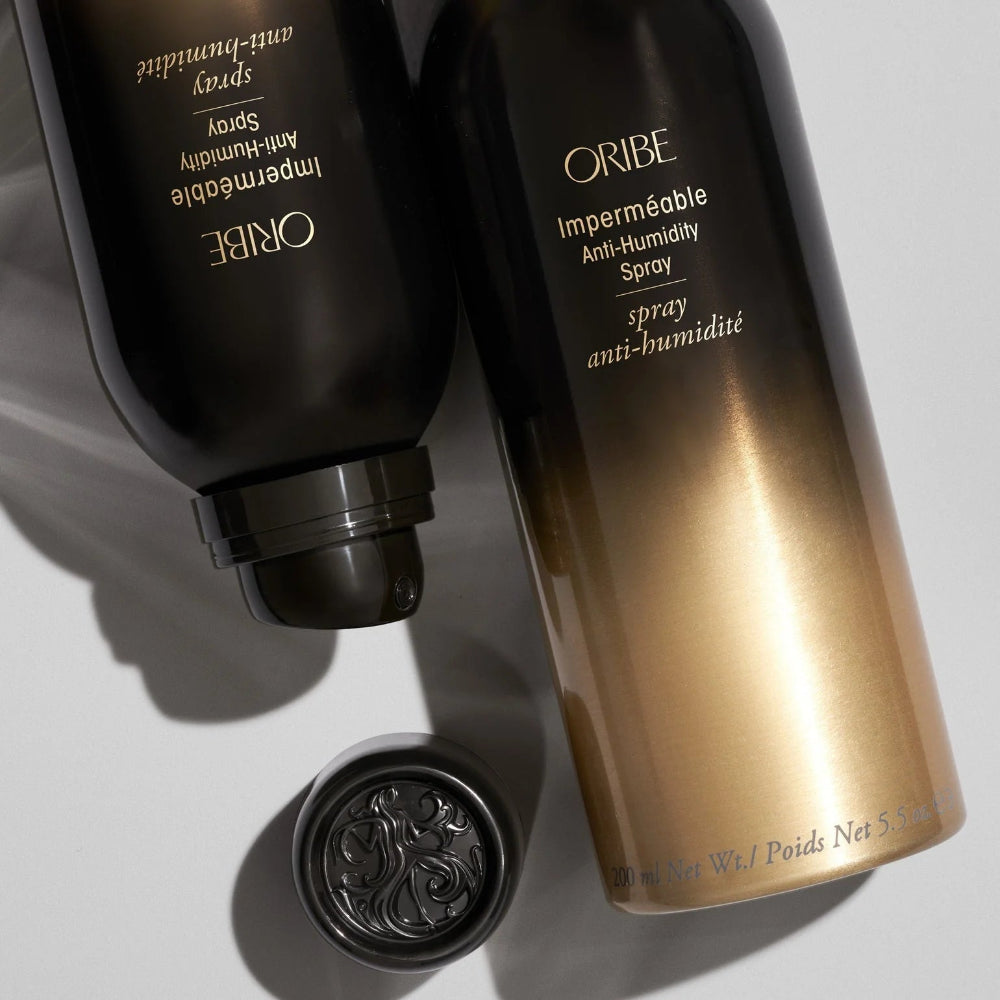 Oribe anti-humidity hair spray collection close-up showing luxury packaging details