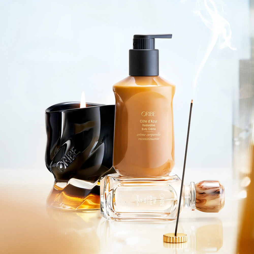 Oribe Côte d’Azur body wash and body crème styled in bathroom setting with fragrance