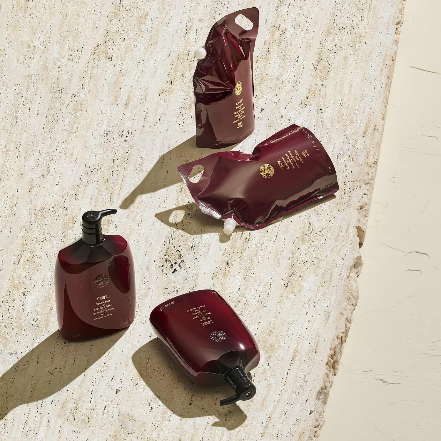 Oribe color care shampoo collection displayed with multiple sizes for maintaining vibrant, healthy hair color