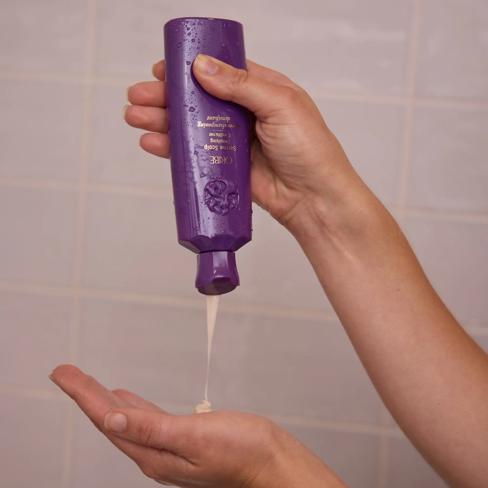 dispensing Oribe Serene Scalp Densifying Conditioner for lightweight hydration and scalp care