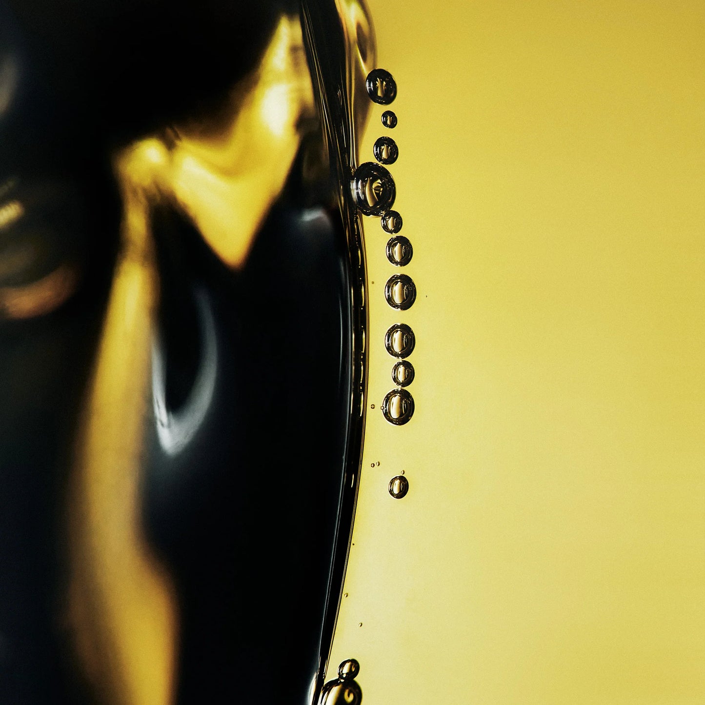 Close-up of Oribe eternal oil droplets background