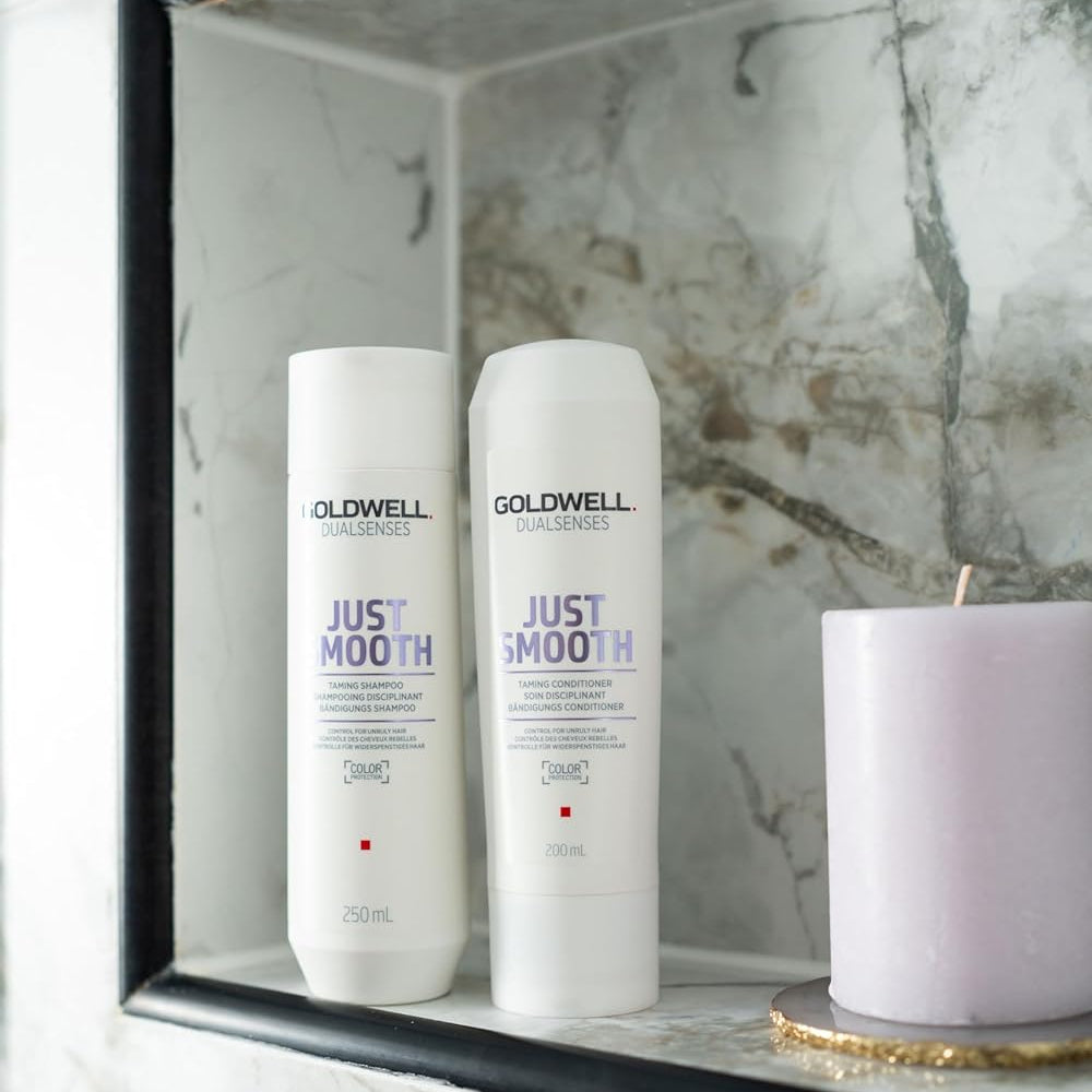 Goldwell Dualsenses Just Smooth shampoo and conditioner in shower for a salon smoothing hair routine