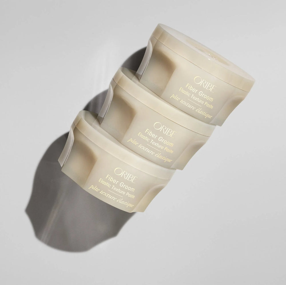 Oribe Fiber Groom paste elastic fiber texture showing stretch and flexible styling control