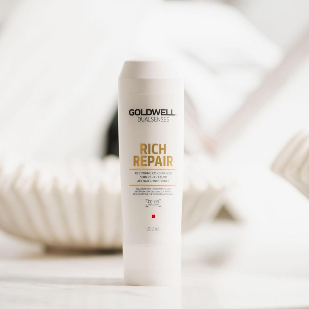 Goldwell Rich Repair conditioner used in professional salon setting for damaged hair treatment