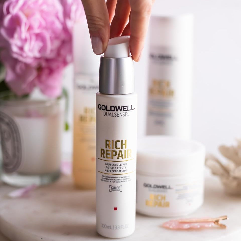 hand holding Goldwell Rich Repair serum for daily hair repair and smoothing routine