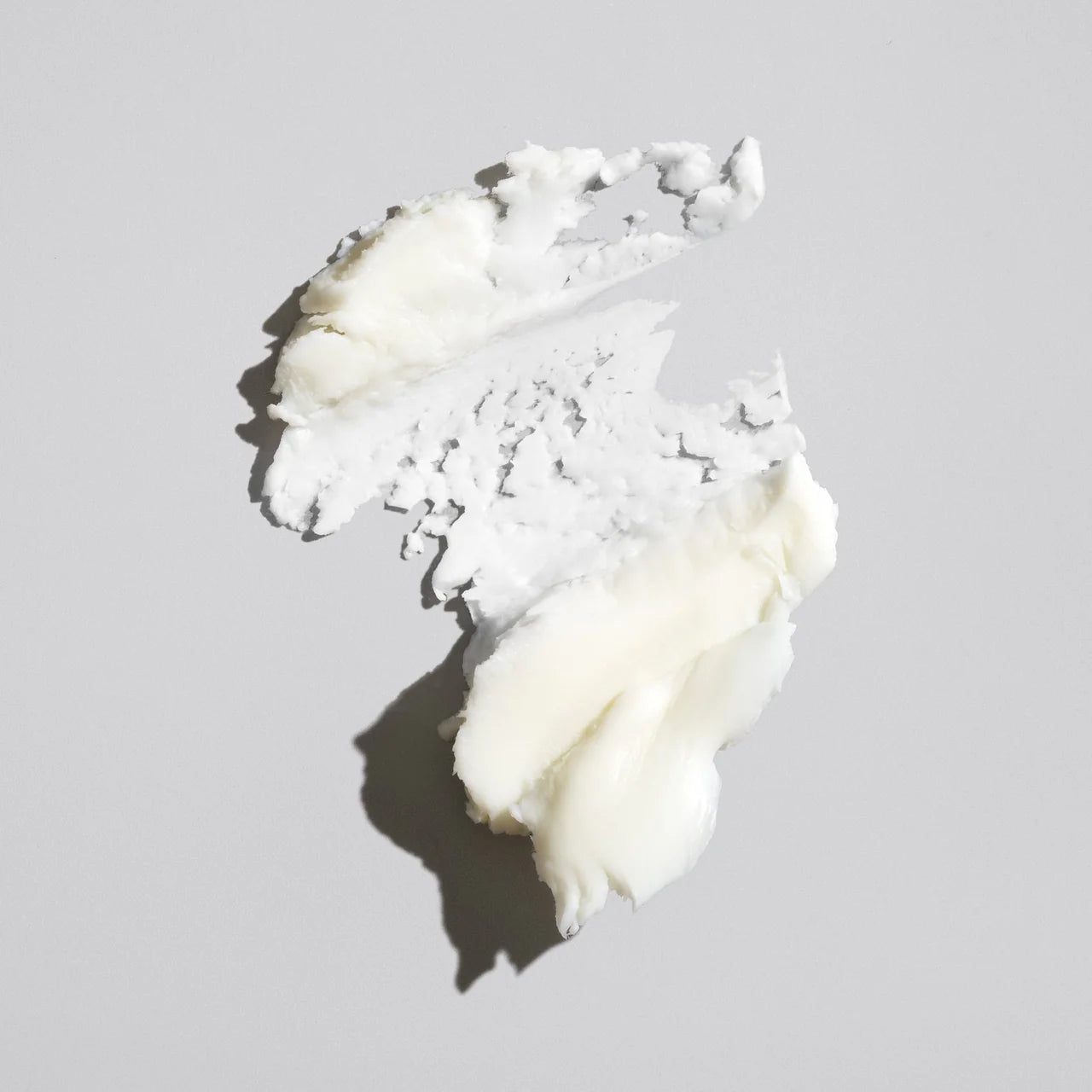 Oribe Rough Luxury paste texture showing pliable styling cream for soft hold