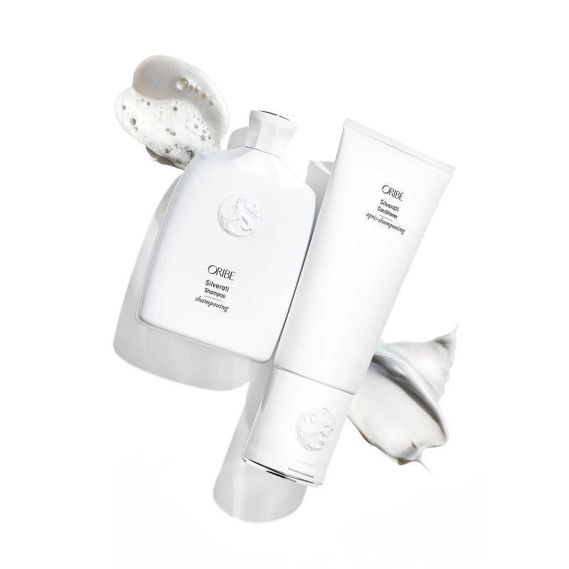 Oribe Silverati Shampoo and Conditioner bottles on a white background