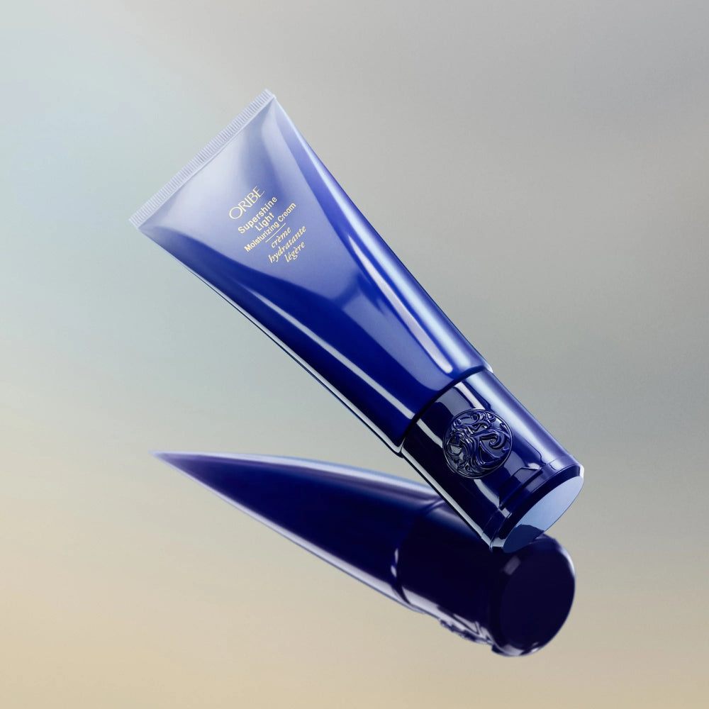 Oribe Supershine Light leave-in moisturizing cream tube for fine to medium hair hydration and shine