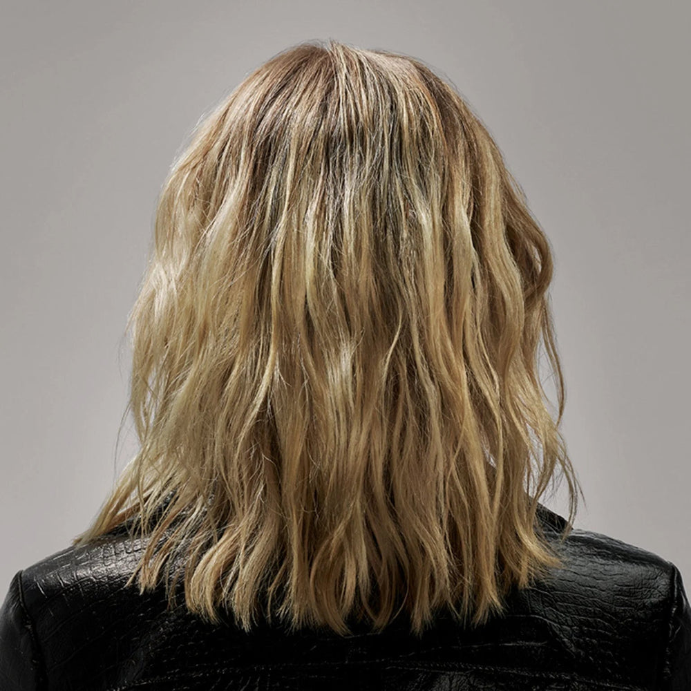 Soft textured waves styled with Oribe Flash Form spray wax for touchable finish